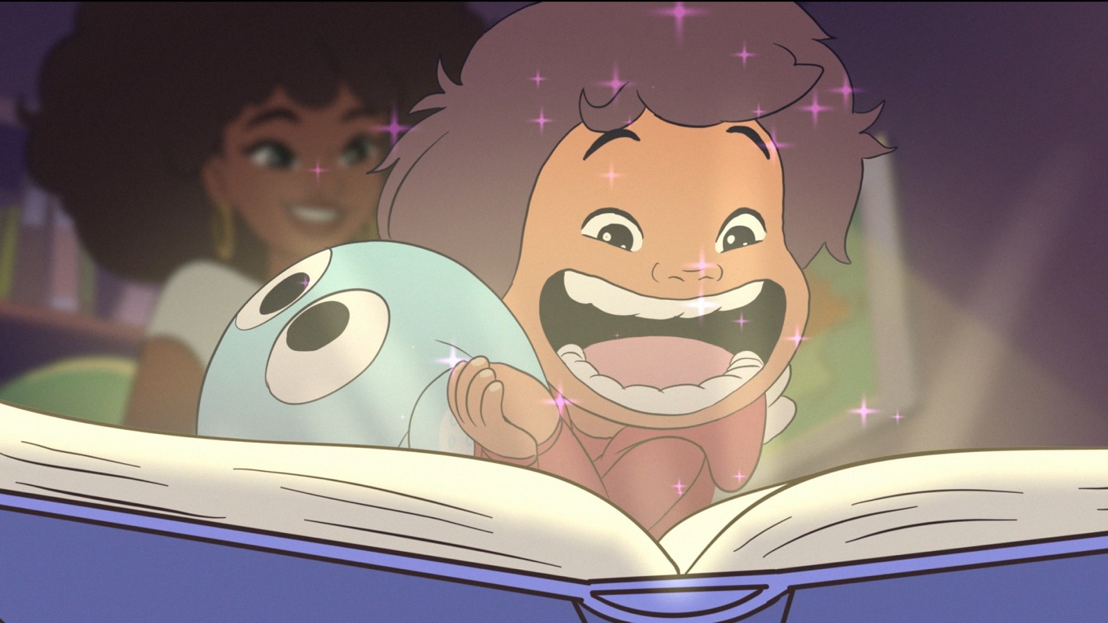 The book glowing as Sebbi and Mari gasp with delight